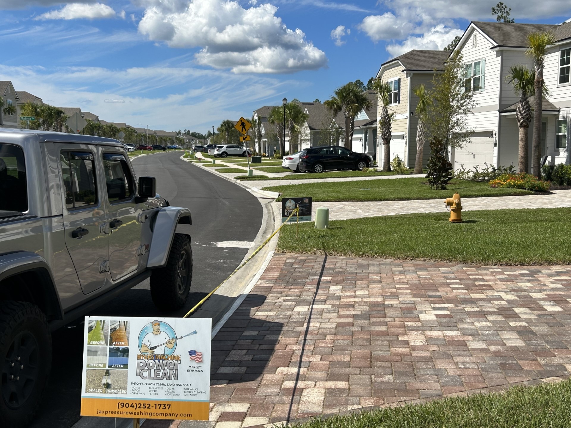 A Byers Machine Power Clean lawn sign.