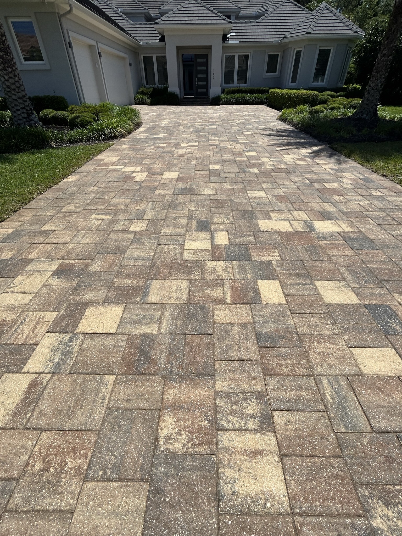 A beautiful paved walkway shines after a deep clean and sealing.